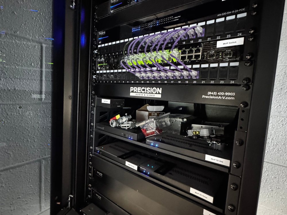 A finished, labeled network and AV rack